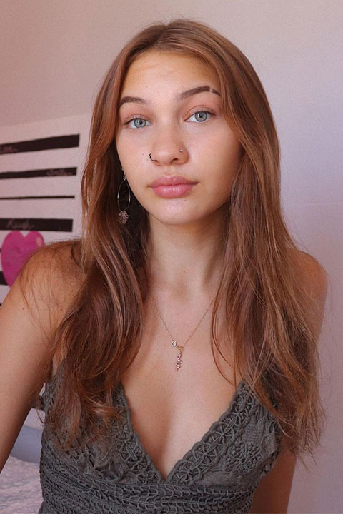 Halia Beamer in open hair and she is wearing beautiful pendant and nose pin.