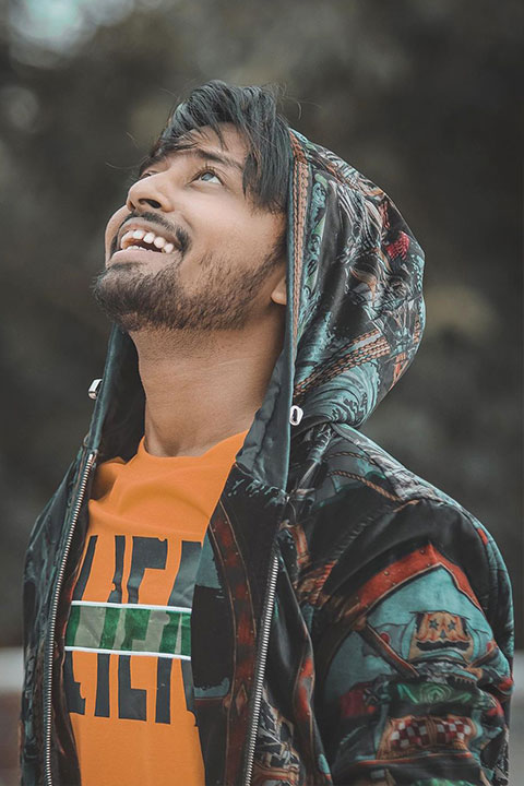 Sohail Shaikh enjoying and being happy while looking up. We can see his perfect jawline