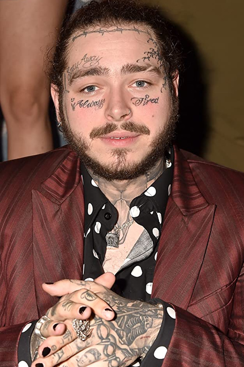 Post Malone in black dotted shirt and wearing mehron coat