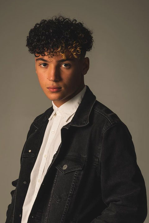 Maximo Rivano is wearing black jacket and looking at the camera.