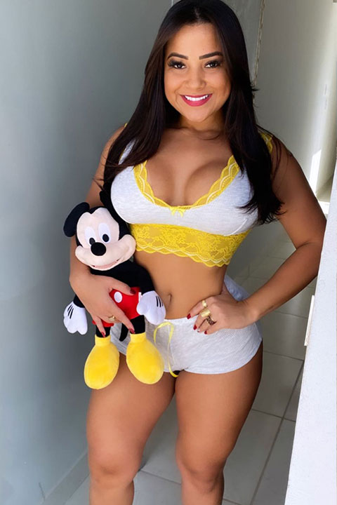 Rayane Pereira is holding micky mouse in her hands