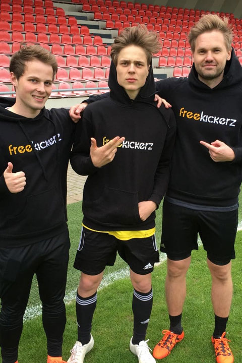 Freekickerz wearing soccer Black jerseys and shorts.